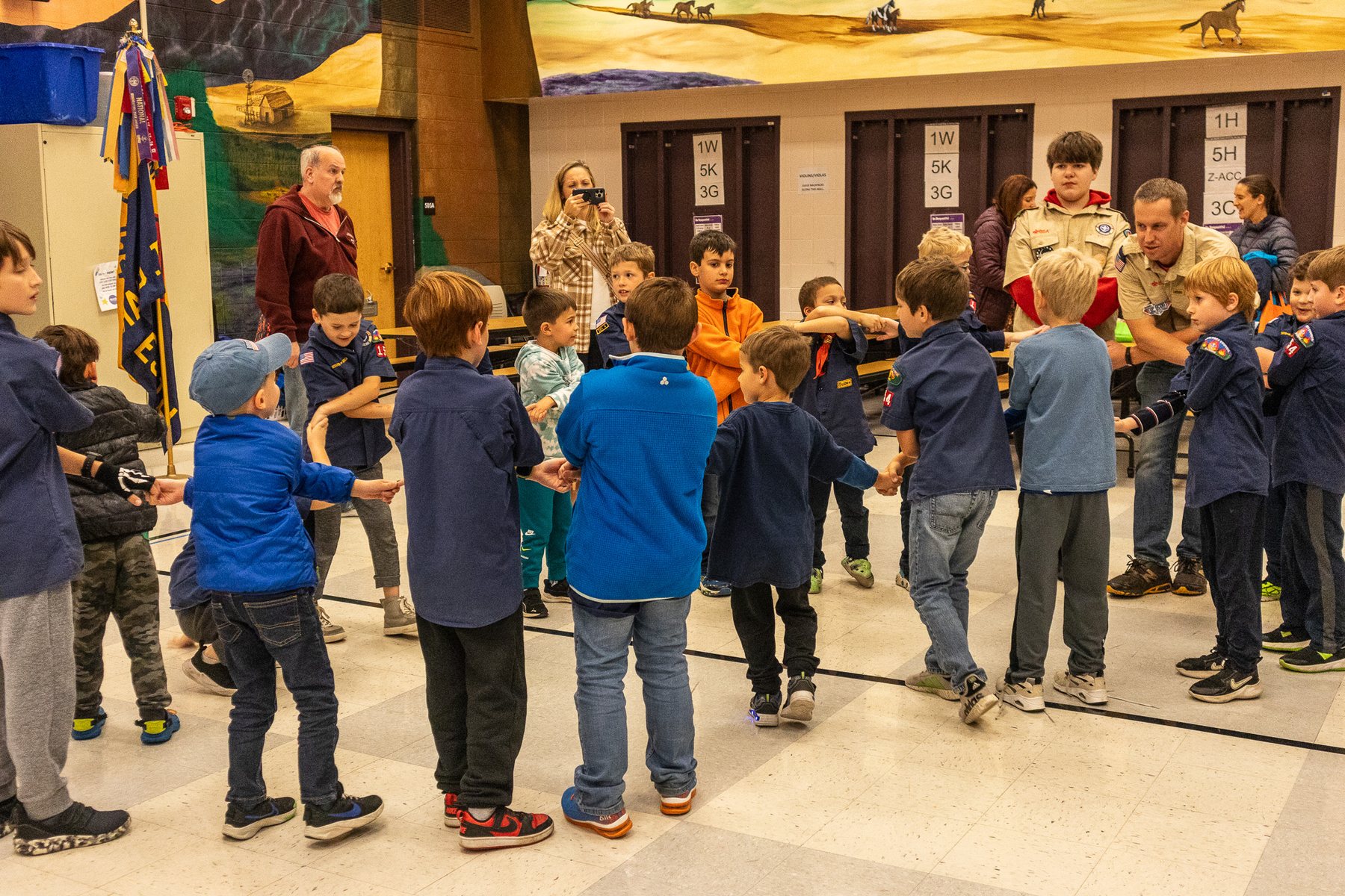 Pack 154 Scouts taking part in a circle activity